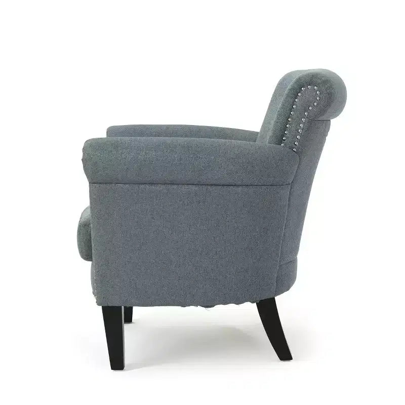Fauteuil club contemporain en tissu Brice avec garniture cloutée