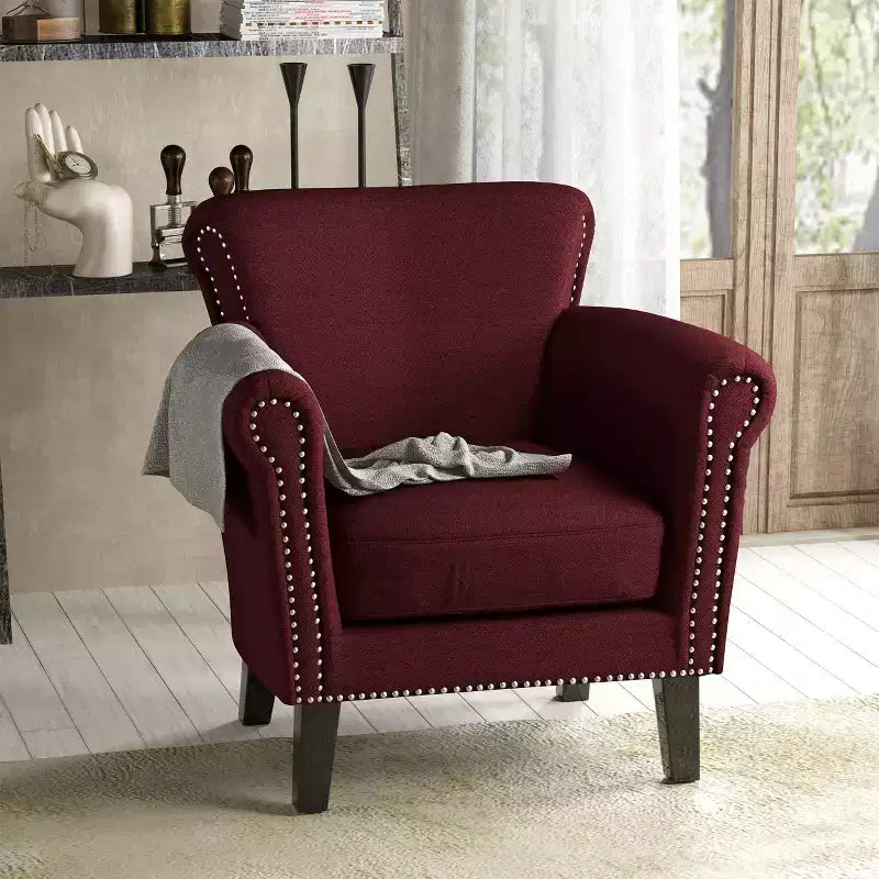 Fauteuil club contemporain en tissu Brice avec garniture cloutée